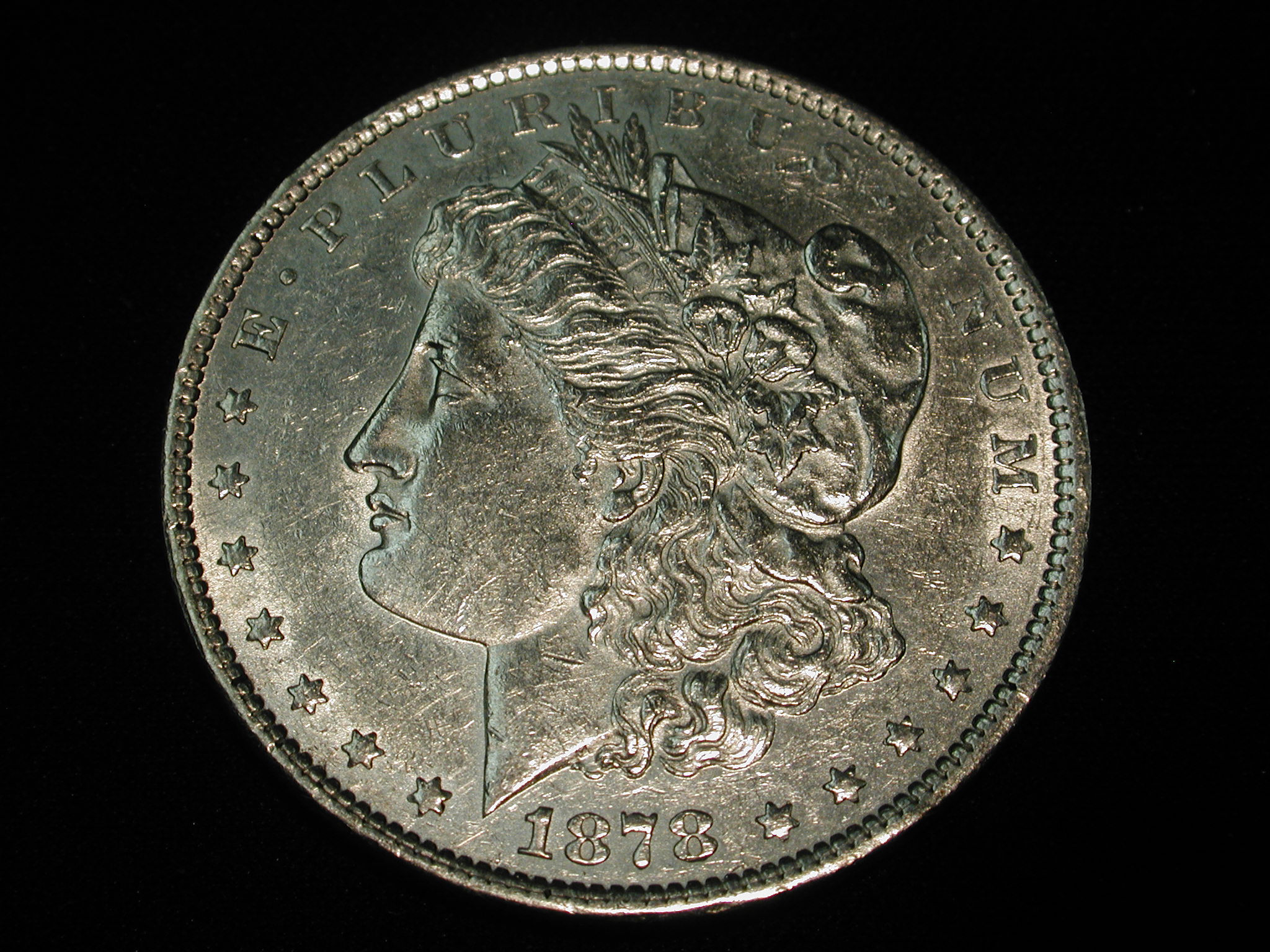 1878 U.S Morgan Silver Dollar Die Crack-Rev. Between OneDollar AU
