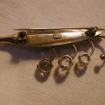 .830 Silver Leaf brooch with three white spinels 2 inches long gold washed