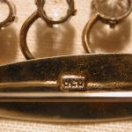 .830 Silver Leaf brooch with three white spinels 2 inches long gold washed