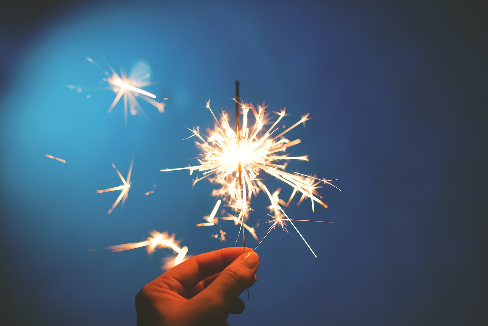 person holding sparkler