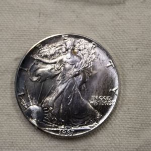 1987 U.S American Eagle 1 Ounce Fine .999 Silver Gem/Choice Rainbow reverse