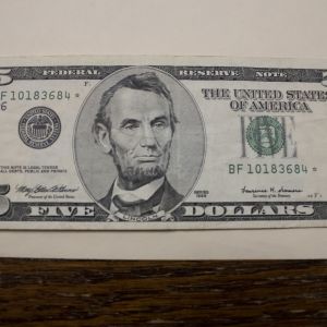 1999 U.S Five Dollar Star Note About Uncirculated