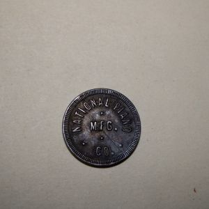 Trade Token National Piano MFG Co. good for one piece of music