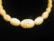 Vintage Celluloid Carved Circles 14" graduated 6mm - 14mm elongated Oval Cream