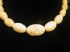 Vintage Celluloid Carved Circles 14" graduated 6mm - 14mm elongated Oval Cream